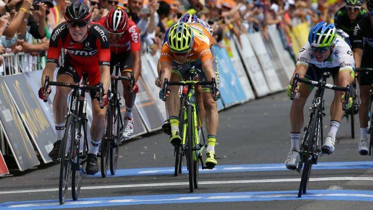  Simon Gerrans (right) edges out BMC's Rohan Dennis on the line totake the overall lead in the Tour Down Under. Photo: John Veage