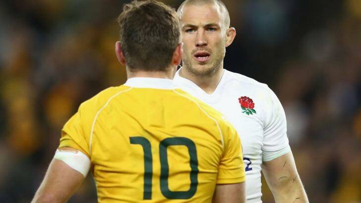 No love lost: Bernard Foley of the Wallabies and Mike Brown of England exchange words. Photo: Getty Images 