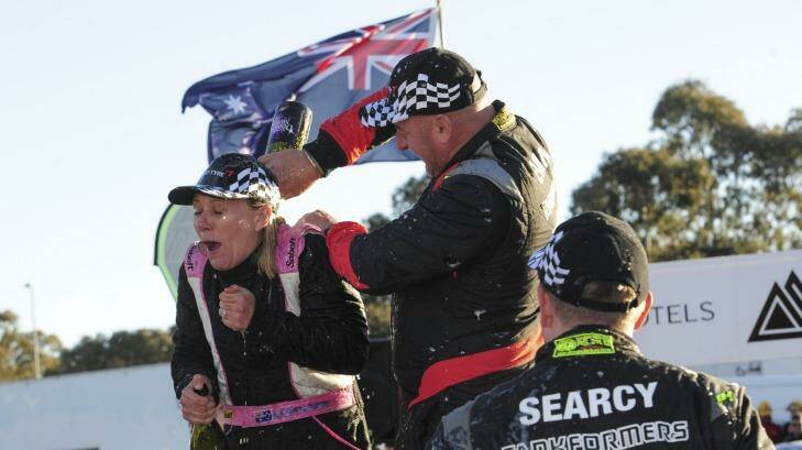 Spoils of victory: Brendan Reeves and co-driver  Rhianon Gelsomino celebrate. Photo: Graham Tidy
