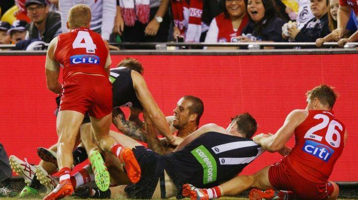 Fracas: Lance Franklin, centre, during the half-time melee sparked by his tackle on Carlton's Zach Tuohy. Photo: Michael Dodge
