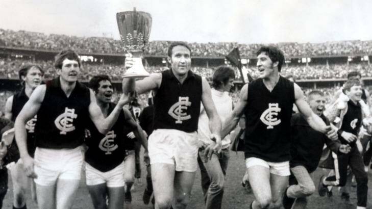Carlton captain John Nicholls holds the 1970 premiership cup aloft