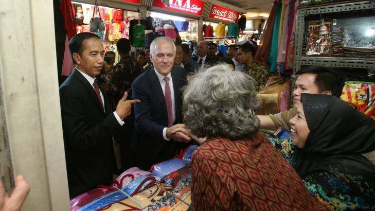 The Australian Prime Minister Malcolm Turnbull with Indonesian president Joko Widodo in Jakarta during a stroll through a local textile markets, in Jakarta.  Photo: Gary Ramage