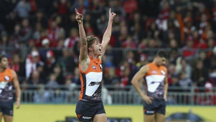 How's that: Giant Lachie Whitfield  celebrates a goal during GWS' victory over the Swans.