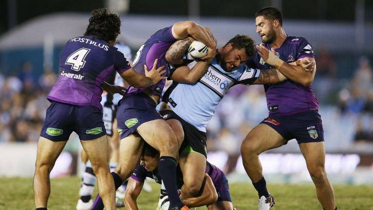 Grappling for the minor premiership: Cronulla Sharks and the Melbourne Storm go head to head on Saturday night. Photo: Brendon Thorne