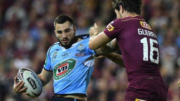 Confident: Jack Bird is tackled by Aidan Guerra of the Maroons during game two of the State Of Origin series on Wednesday. Photo: Matt Roberts