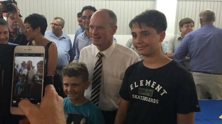 Premier Campbell Newman, campaigning in Mackay, stops for a photo with Rhys Thompson, 9, and Bryce Thompson, 13. Photo: Amy Remeikis