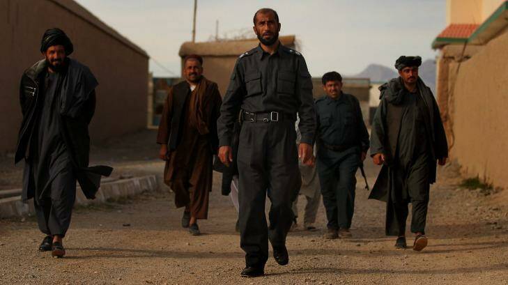 Matiullah Khan and his men at his compound in Tarin Kowt in January 2013. Photo: Kate Geraghty