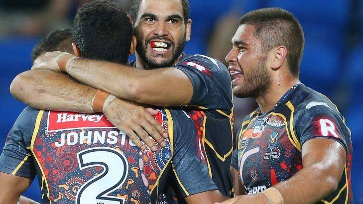 Band of brothers: Inglis celebrates a try . Photo: Chris Hyde