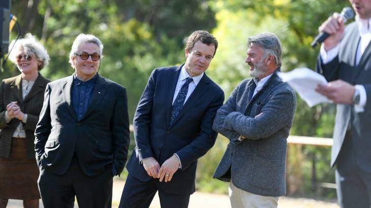 NSW Environment Minister Mark Speakman, accompanied by filmmaker, George Miller, Heritage Minister Mark Speakman and actor Sam Neill, makes an announcement about the future of Tropfest short film festival at Old Government House, Parramatta Park.  Photo: Peter Rae