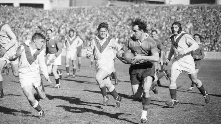 Clive Churchill weaving his magic for the Rabbitohs at the SCG in 1953. Photo: Harry Martin