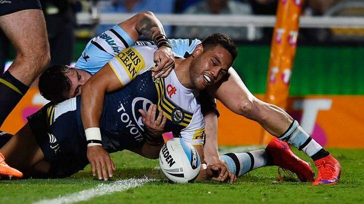 Winging it: Antonio Winterstein scores a try for the North Queensland Cowboys against the Cronulla Sharks at 1300SMILES Stadium. Photo: Ian Hitchcock
