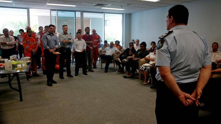 Police and emergency services personnel meet on Monday in the aftermath of the killing of eight children in Cairns. Photo: Edwina Pickles