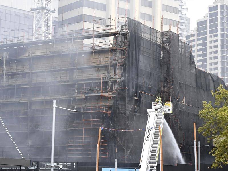 A 10-storey building covered in net-meshing near Circular Quay in Sydney has caught fire.
