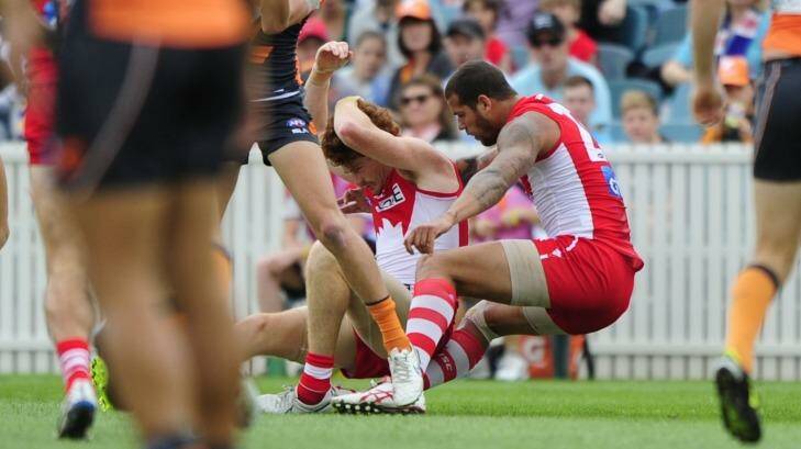 Impact: Lance Franklin reels after the head clash with Gary Rohan.  Photo: Melissa Adams