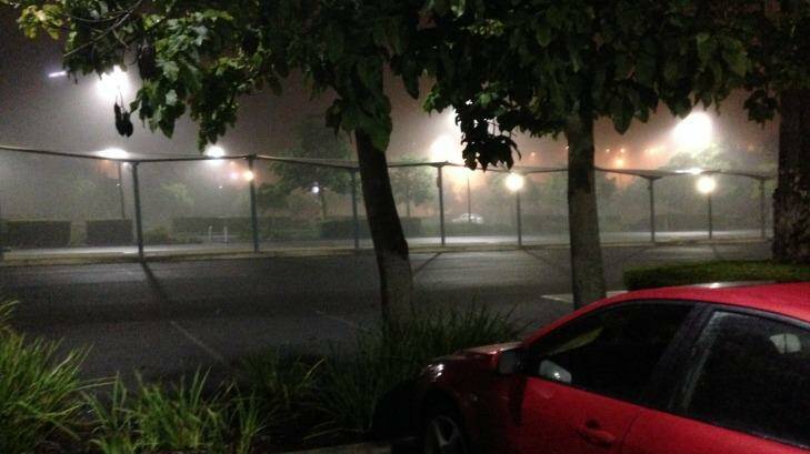 Fog smothers the bus station at Eight Mile Plains in Brisbane about 4.30am. Photo: Ben Bissett