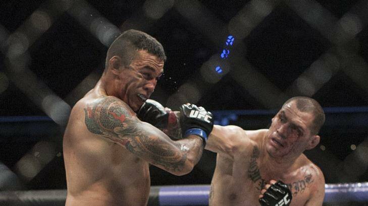 Velasquez takes a right from Werdum during the bout. Photo: Christian Palma