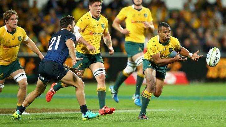 The Wallabies' Will Genia gets a pass away in Saturday's win over Argentina in Perth. Photo: Cameron Spencer