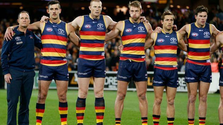 The Crows line up for the national anthem. Photo: Adam Trafford/AFL Media