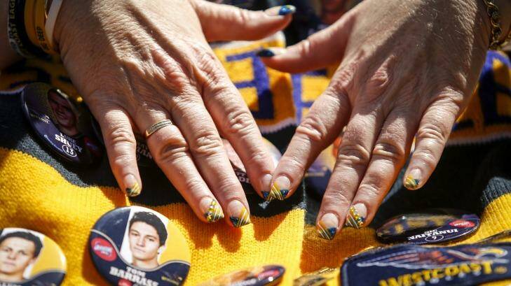 Footy fans were decked from head to finger tips in their team colours at the parade. Photo: Eddie Jim