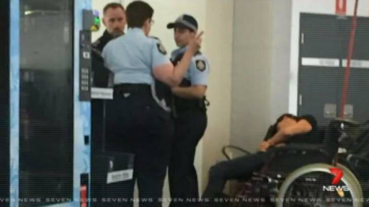 This photo reportedly shows Grant Hackett slumped in a wheelchair after being removed from the plane after an altercation. Photo: Channel Seven