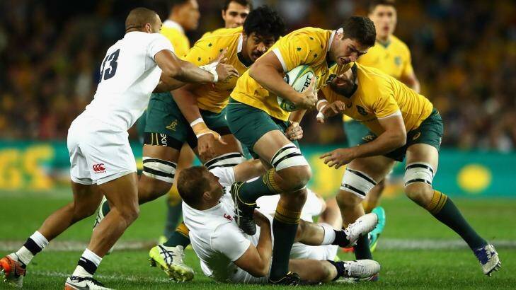 Rounded up: Wallabies forward Rob Simmons is tackled during the Test between Australia and England at Allianz Stadium. Photo: Cameron Spencer