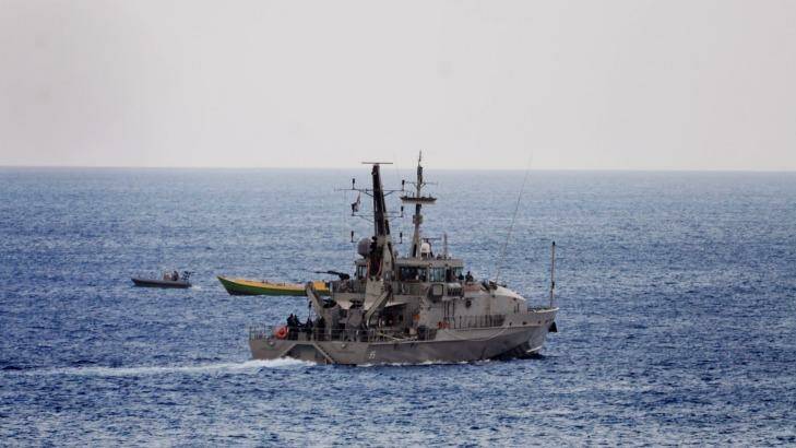 An Australian Navy vessel approaches a suspected refugee boat off the coast of Christmas Island last week.
