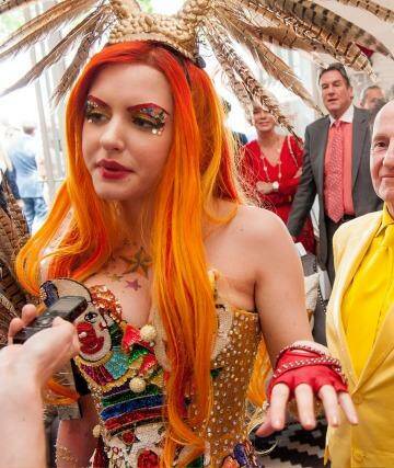The ever understated Geoffrey Edelsten and his new fiancee Gabi Grecko enjoy the Emirates marquee on Melbourne Cup day Photo: Jesse Marlow