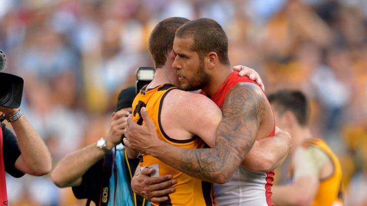 Jarryd Roughead embraces his friend and former teammate Lance Franklin after the 2014 grand final Photo: Joe Armao