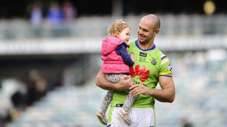 Canberra Raiders player Dane Tilse with daughter Ila after playing his 200th game and his last home game for the Canberra Raiders.  Photo: Melissa Adams MLA