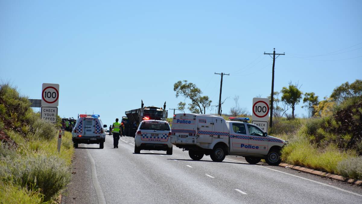 The scene where a road train has crashed about 10km East of Mount Isa, near the 100km/h sign between Telstra Hill and Breakaway Creek Drive.