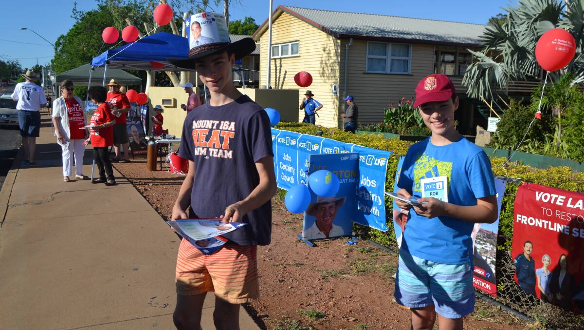 Never too young: Will and Tom Nioa encourage voters to choose KAP's Rob Katter while at Central State School, Mount Isa.  
