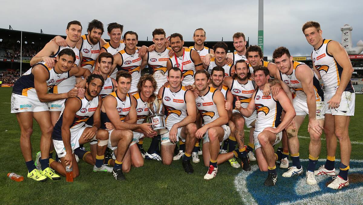 The Eagles pose with the Western Derby trophy after winning the round 20 AFL match between the Fremantle Dockers and the West Coast Eagles at Domain Stadium on August 16, 2015 in Perth, Australia. Photo: Getty Images.