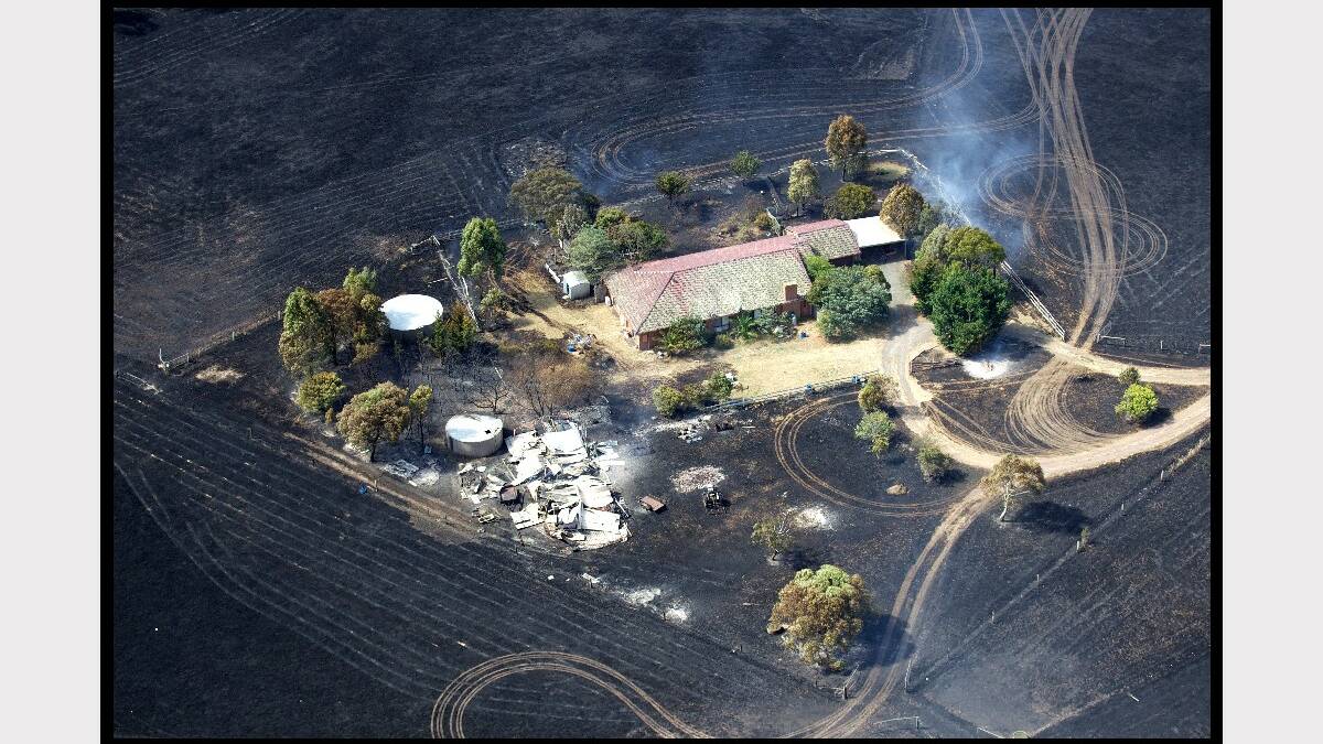 Fire moving through the town of Gisborne photographed from the air in a helicopter. Photo: Simon O'Dwyer. Fairfax Media. 