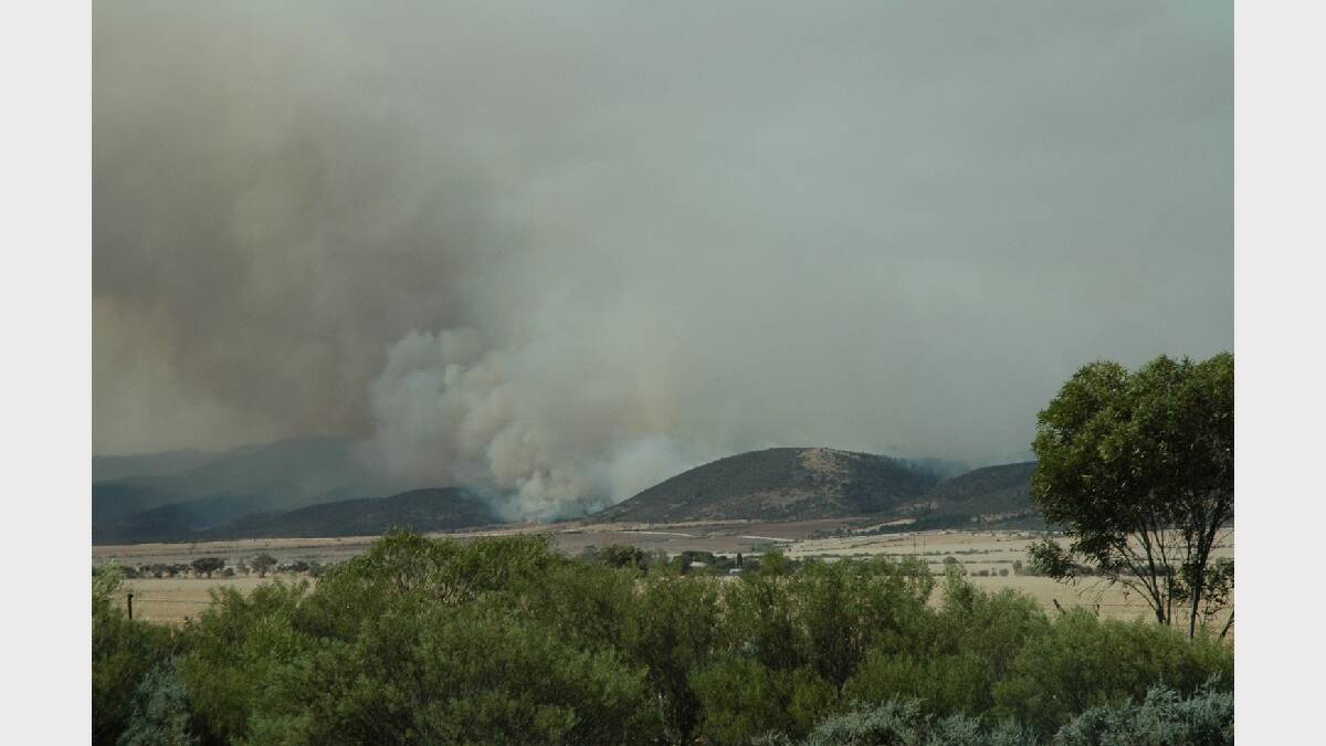 Flashes of flame could be seen from the Augusta Highway as the foothills flared near
Napperby and Beetaloo Valley. Photo: Greg Mayfield.