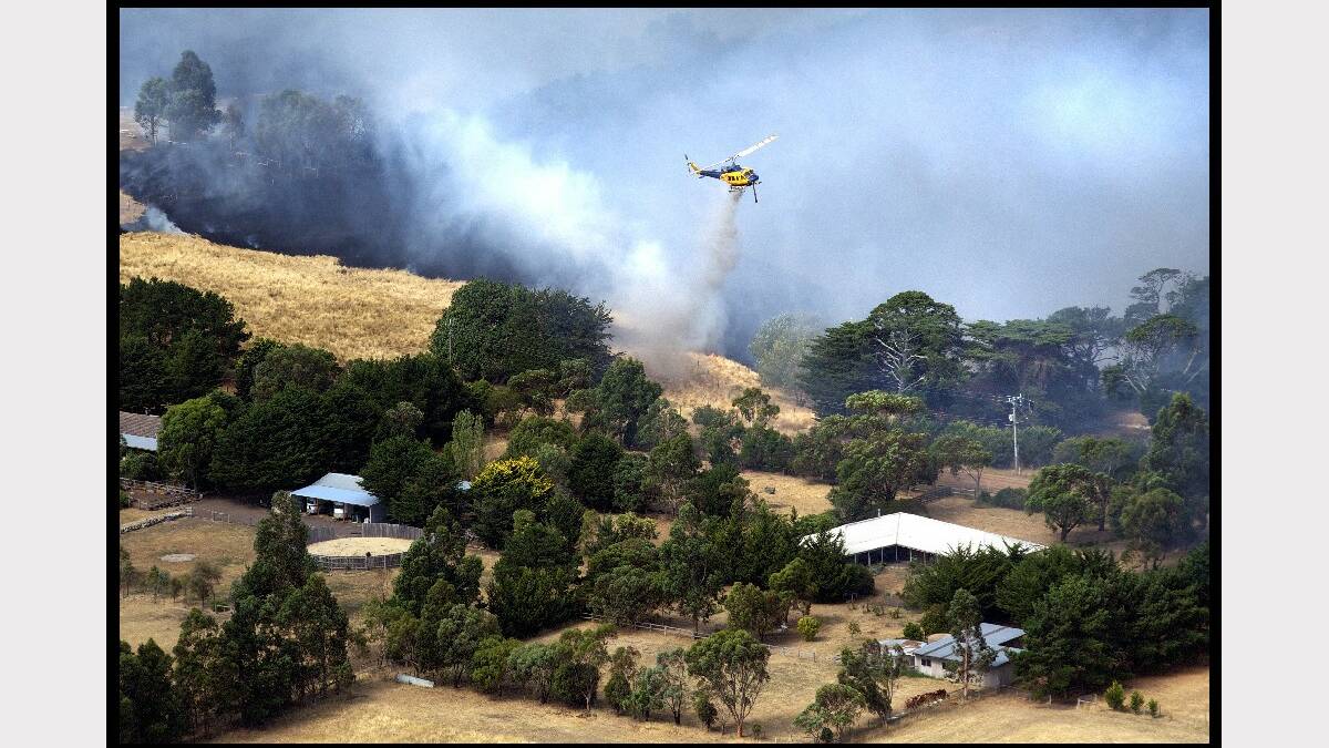 Fire moving through the town of Gisborne photographed from the air in a helicopter. Photo: Simon O'Dwyer. Fairfax Media.
