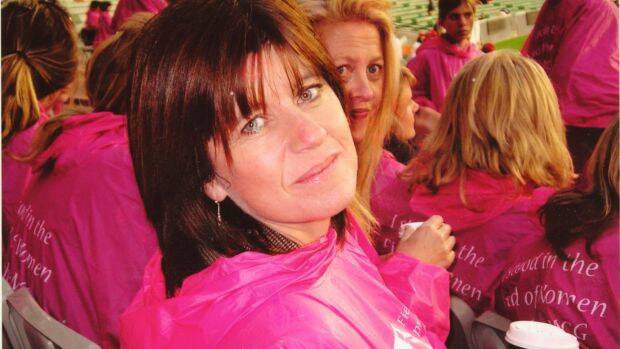Caroline Wilson (with best friend Corrie Perkin just behind her) at one of the Melbourne Football Club's Pink Lady Matches for breast cancer. Photo: Supplied

