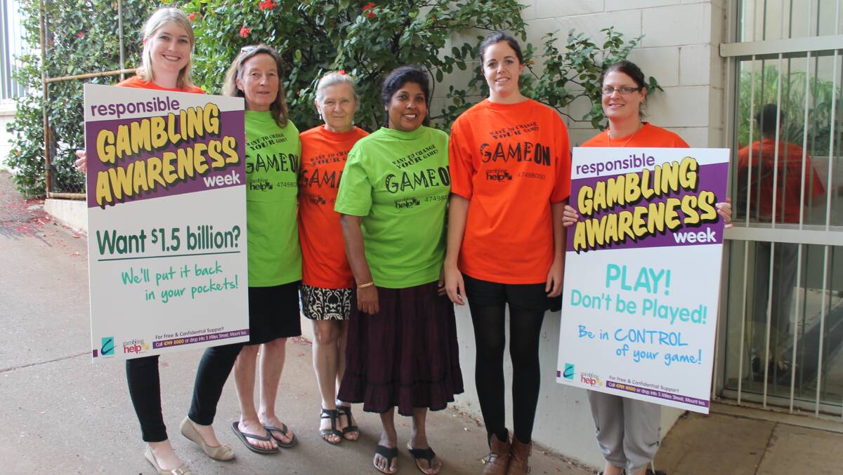 Laura (surname withheld), Robyn Rooke, Liz Gibson, Menik Gunasekera, Rebecca van Velzen and Melissa Martin holding the gambling awareness signs that were placed around the city over the weekend for Responsible Gambling Awareness Week. Picture:  HAILEY RENAULT
