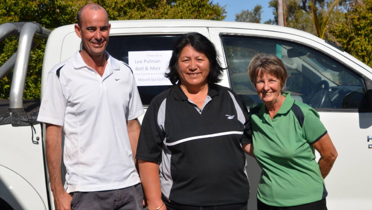 MOUNT ISA GOLF CLUB MIXED FOURSOMES CHAMPIONSHIP WINNERS: Jamie Stewart (nett winner), Auretta Perrin (gross winner), and Sheila Stewart (nett winner) stand in front of a brand new Toyota Hilux donated by Lee Pulman at Bell & Moir Toyota Dealership.
