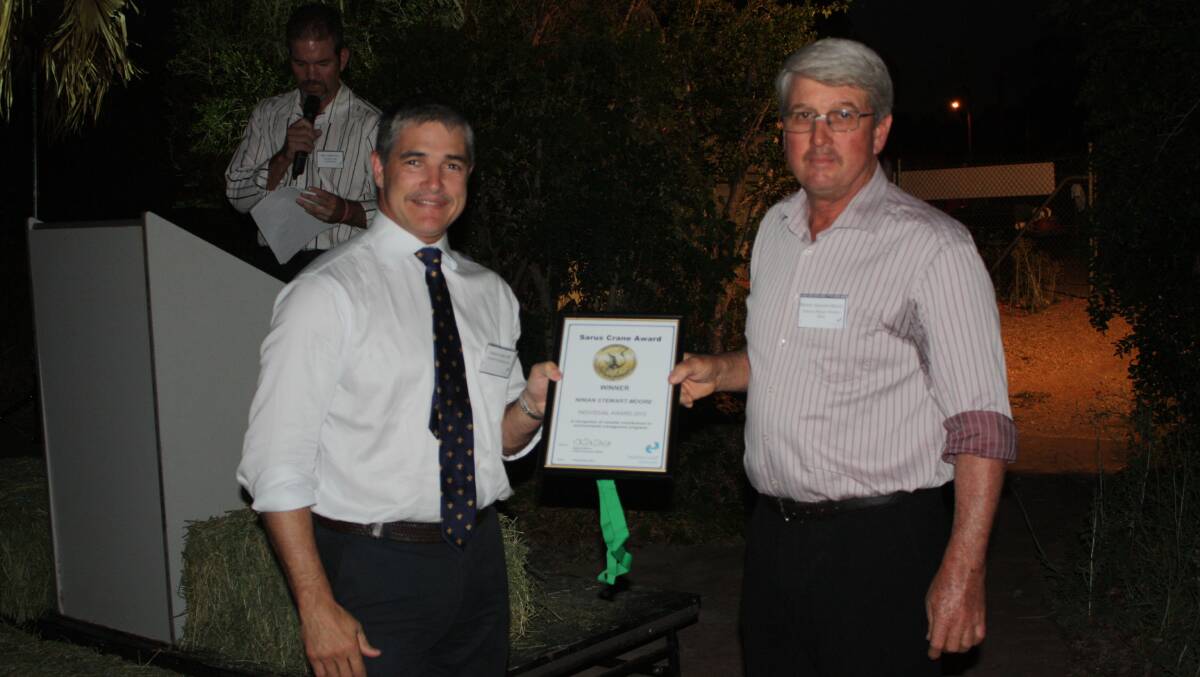 AWARD: State member for Mount Isa Robbie Katter presents the award to Flinders Shire Deputy Mayor Ninian Stewart-Moore.