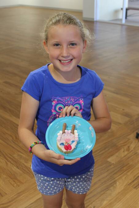Jorgia Green, 9, shows off her Easter cake.