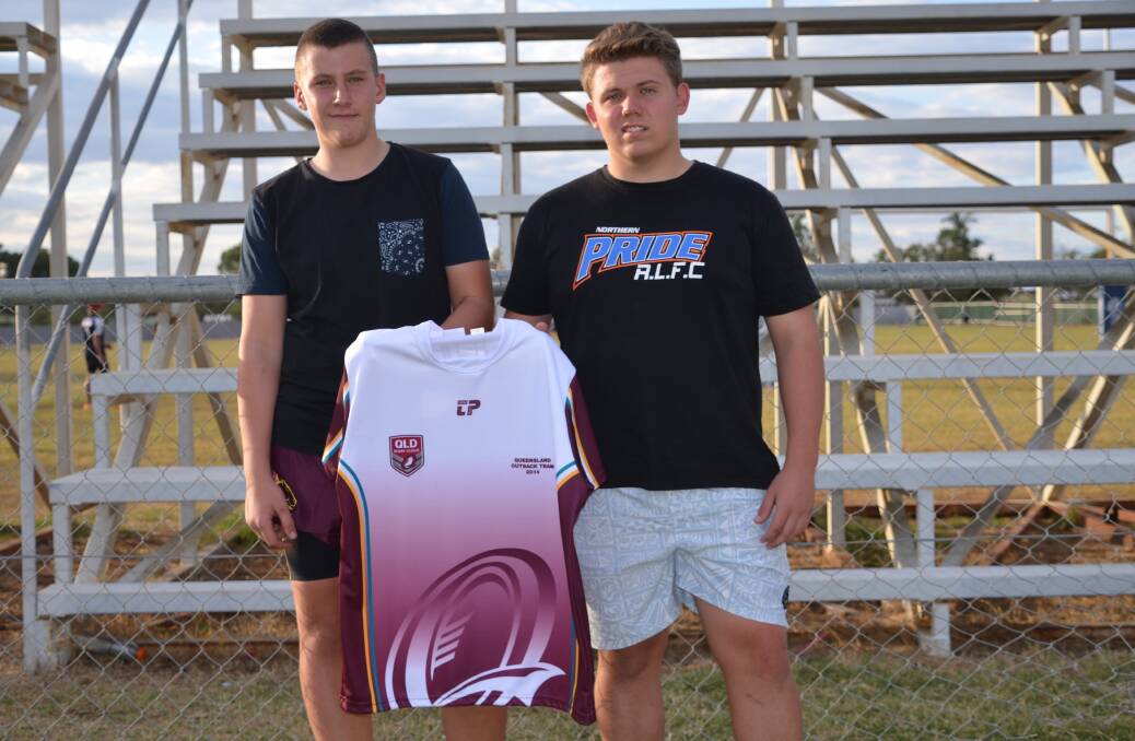 U14 Northern Outback centre Trent Roberts and U16 Northern Outback prop Jeremy Murphy hold the jersey of the team they will be trialling for this weekend in Charleville.