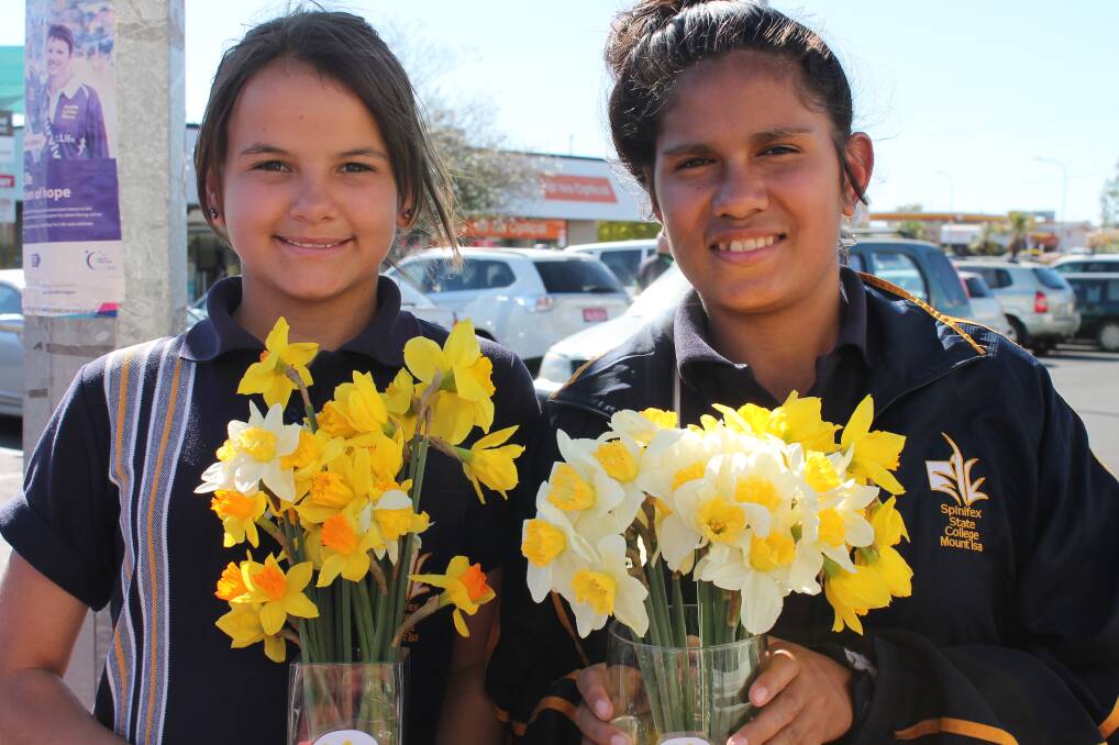 DAFFODIL DAY: Spinifex State College Residential Campus students Tia Sollitt and Tamhian Rosser, both 14, selling daffodils to help support the Cancer Council. – Picture: HAILEY RENAULT/8228