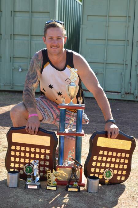 Kyle Keighery surrounded by silverware after the Mount Isa Cricket Association men’s awards.