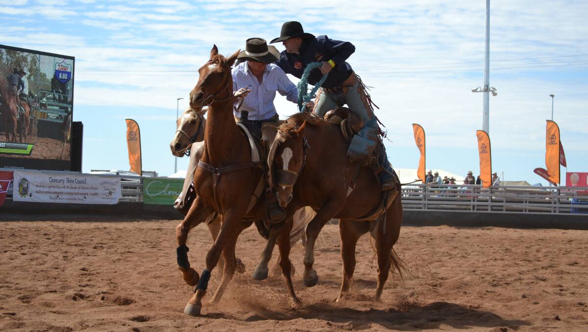 HELPING HAND: Jake Malay-Murphy (right) swaps broncs in the second division saddle.