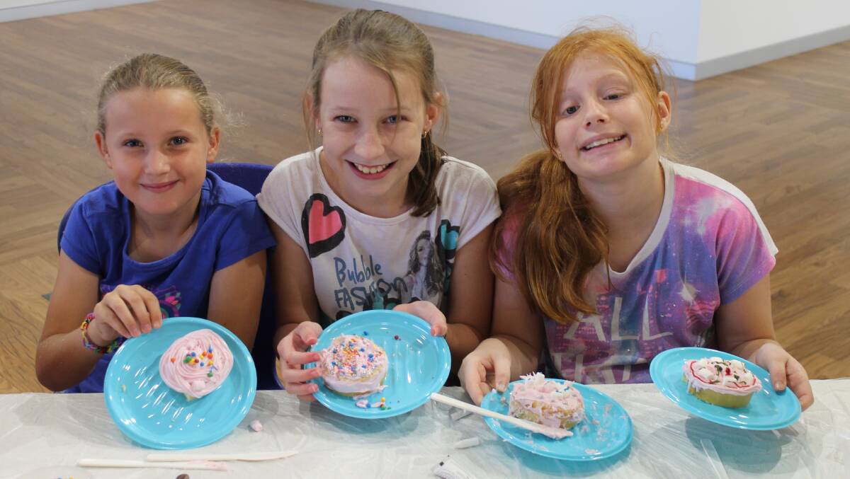 Jorgia Green, 9, Hannah Costello, 11, and Taylor Jacobsen, 11, made the most of the Bob McDonald Library's school holiday program.