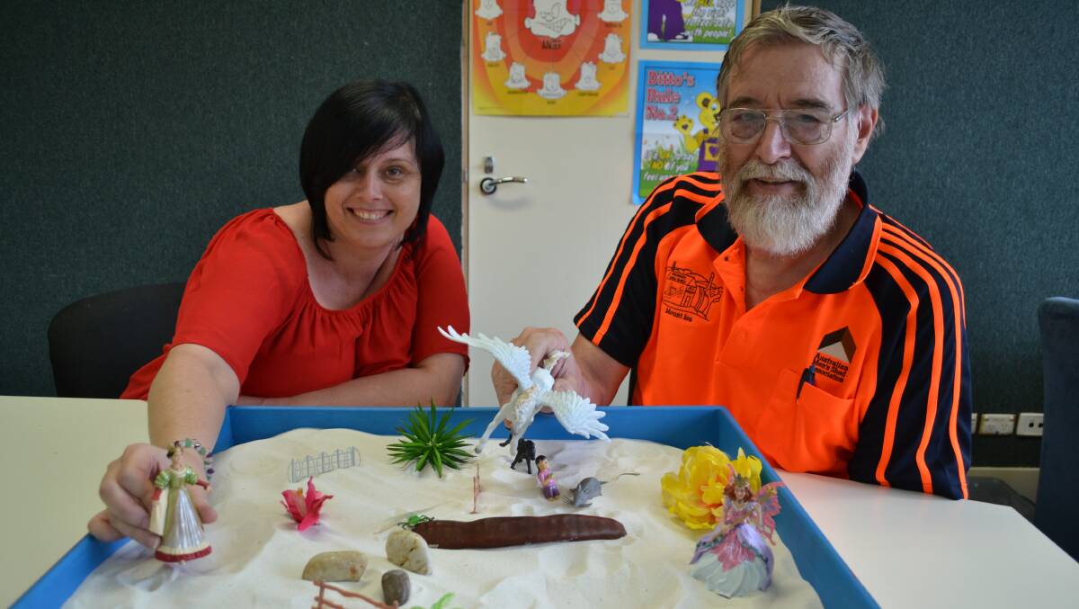 PLAY TIME: Centacare counsellor Tina Blizzard and Men's Shed member Richard Lane enjoy some play time therapy.