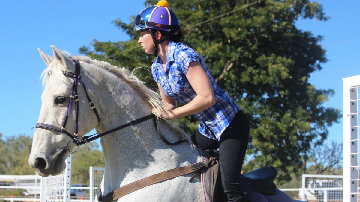 Jockey Tamara Tincknell winning the open showjumping on Ruling Raffin. Tamara swapped her racing silks for a casual riding outfit to enjoy a day at the gymkhana.