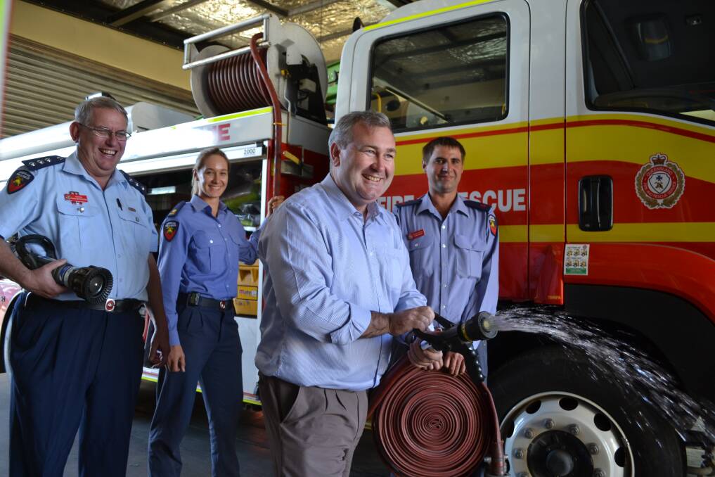 CHECKING UP: Minister for Fire and Emergency Services Jack Dempsey tests the equipment at Queensland Fire and Rescue Services, Western Command, in Mount Isa, along with Inspector Ross Mutzelburg, auxiliary officer Sarah Steinegg and lieutenant James Evans. 