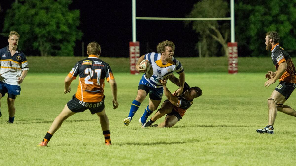 DOWN: Cloncurry skipper Hamish Chrisp is cut down by strong Warrigals defence at the weekend. Photo: Kerry Brisbane