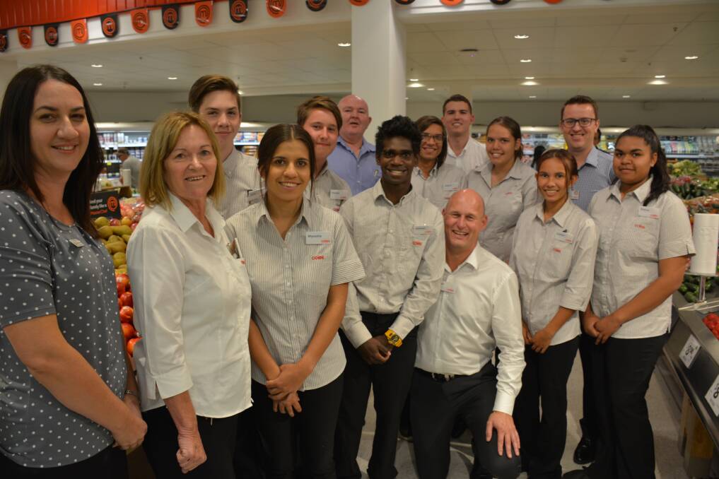 RECRUITED: Spinifex students pictured with school indigenous support officer Megan Graham and Coles employees including Queensland general manager Paul Bradshaw.